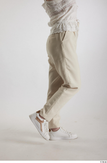 Yeva  1 beige pants casual dressed flexing leg side…